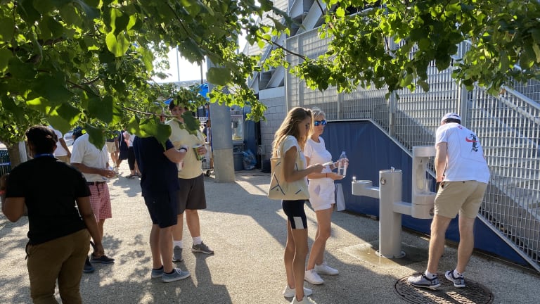 It was a familiar sight: parched fans filling up water bottles on a hot day in Queens. But the way in which they did was rather unfamiliar.