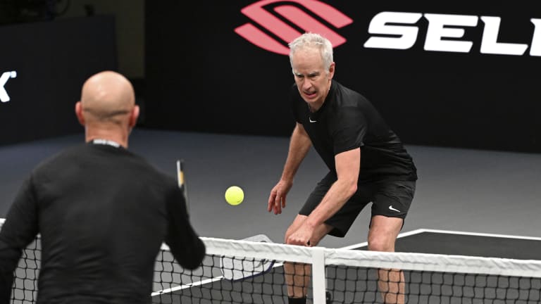 Earlier, McEnroe lost a men’s doubles match with James Blake to Agassi and Jack Sock.