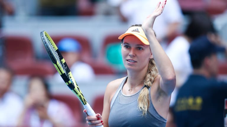 Defending Beijing champion Caroline Wozniacki returns to quarterfinals