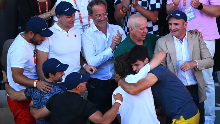 Alcaraz and Ferrero, who won Roland Garros in 2003, embrace after the former defeated Alexander Zverev in five sets on Sunday.