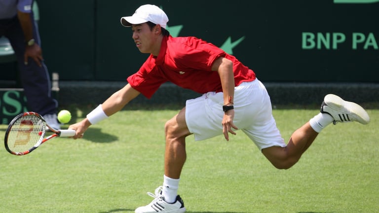 Kei Nishikori uses his foot speed and hand speed to return a shot during an Asia/Oceania Zone Group I Davis Cup  match against Rohan Bopann.