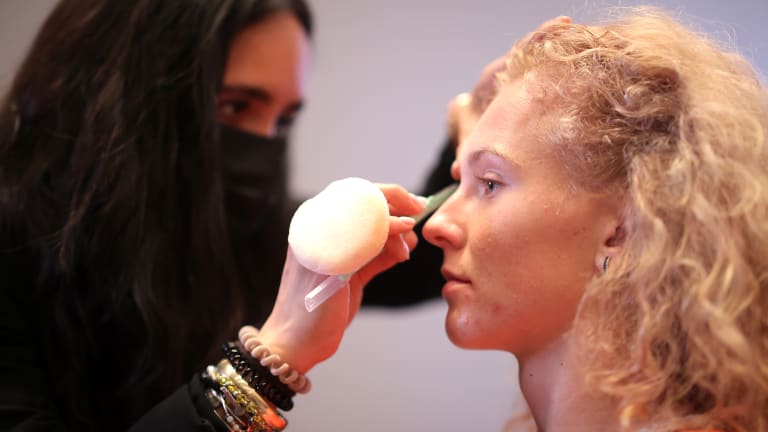 The singles world No.2 begins her look in the makeup chair.