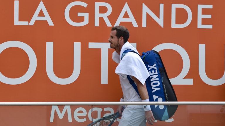 Murray walks off Court Simone Mathieu after a workmanlike practice session.