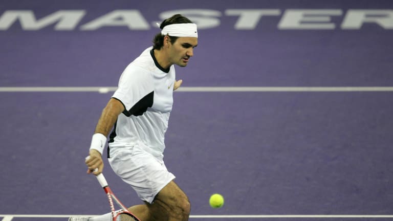 Roger Federer hits a drop shot during his semi-final match at the 2005 Tennis Masters Cup.