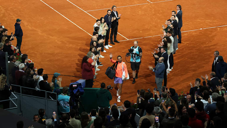 Organizers and staff including tournament director Feliciano Lopez formed a guard of honor to send Nadal on his way.