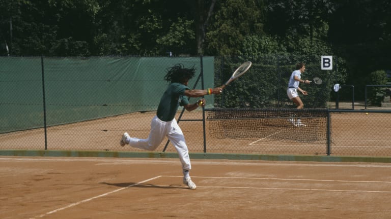 Yannick Noah practicing alongside fellow Frenchman Christophe Roger-Vasselin, before their unexpected semifinal encounter.