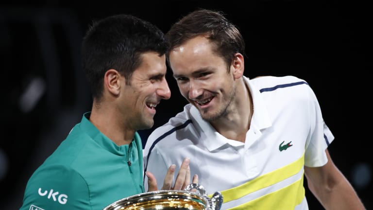 Djokovic shares a joke with Medvedev following their men’s singles AO Final battle.