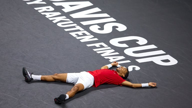 Auger-Aliassime celebrates with joy after winning the Davis Cup final against Australia.