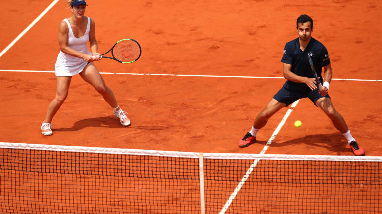 Looks of the day: 
Mixed doubles champs
reclaim their thrown