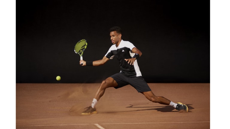 Felix Auger-Aliassime is in the Heat.Rdy Pro Freelift Henly Polo Shirt ($85) and 2-in-1 Paris Pro Short ($75)