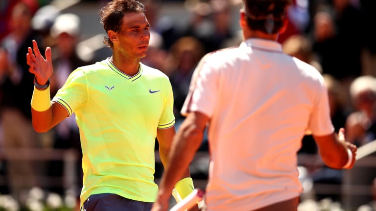 A sturdy and stoic Rafael Nadal survived the wind and Roger Federer