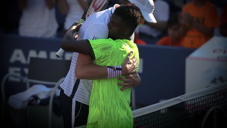 Photo of the Day:
Isner, Tiafoe hug
it out