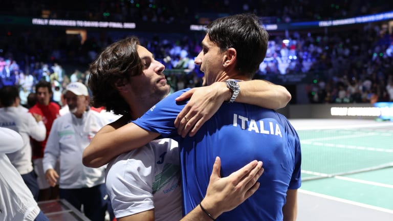 Musetti, who dropped the day's first match in singles, embraces Sonego, who teamed with Sinner to see Italy through to the Davis Cup final in dramatic fashion.