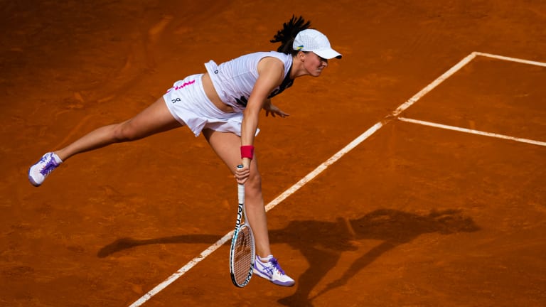 Iga Swiatek of Poland in action against Bernarda Pera of the United States in the third round on Day Seven of the Mutua Madrid Open