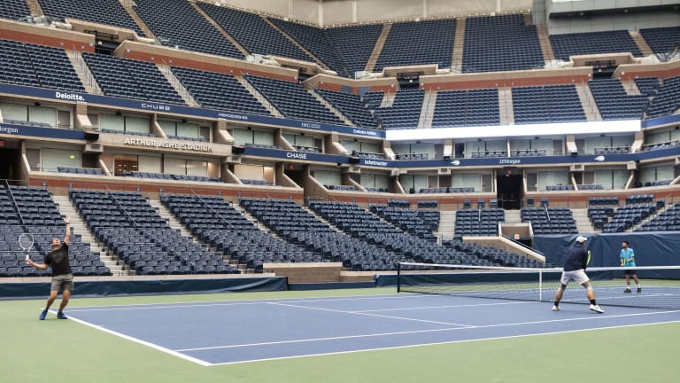 Arthur Ashe Stadium, on the outside, before this year's US Open. Augustin Huynh, David Goode and Jeff Carpenter, three USTA league players from the New York City area, made a charity bid for an hour of court time in the world’s biggest tennis arena this spring? “I was pumped,” Carpenter said. “I sort of had a king-of-the-world feeling.”