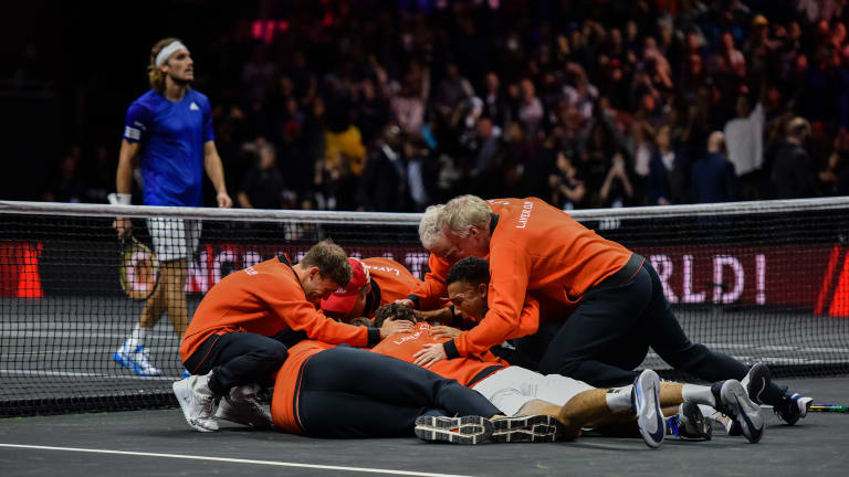 ... before the rest of the Team World squad piled together as Stefanos Tsitsipas walked to his bench in defeat.