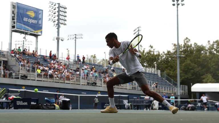 Pictured here before the tournament, Auger-Aliassime was one of the players who drew a crowd–in the bleachers and in the tunnel—on the practice courts.
