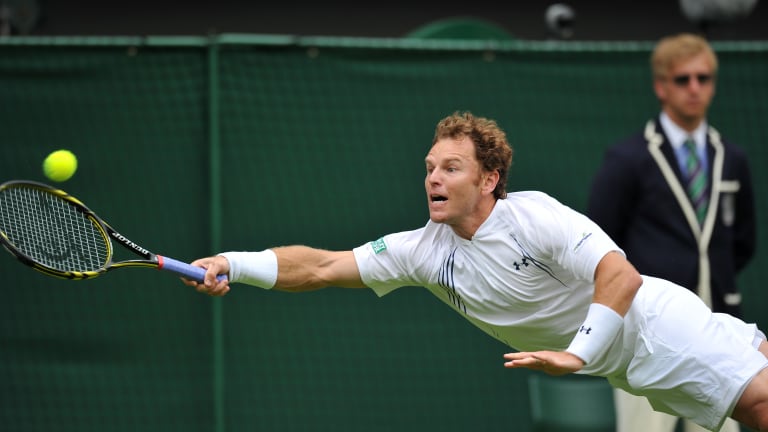 Michael Russell lays out at the 2011 Wimbledon Championships.