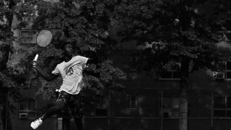 Donovan Spinger smashes an overhead during practice in New York.