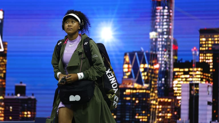 Naomi's full match kit included a green warm-up trench and an oversized hip bag from her Nike capsule collection.