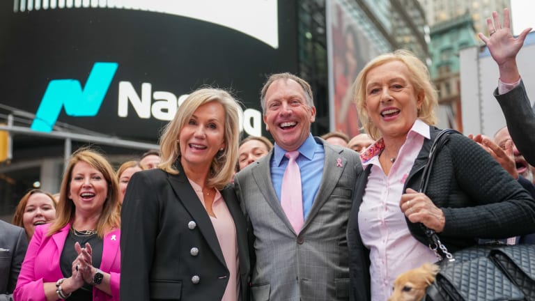Martina Navratilova and dog Lulu (right) joined WTA president Micky Lawler and Hologic CEO and president Steve MacMillan in Times Square.