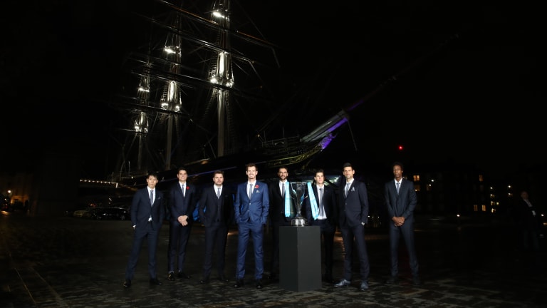 Players seem to almost fade into the London night in this 2016 group photo. (That's the historic sailing ship Cutty Sark in the background.)