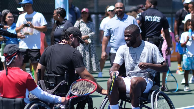 The wheelchair tennis players in attendance encouraged Tiafoe to join them to play out some points.