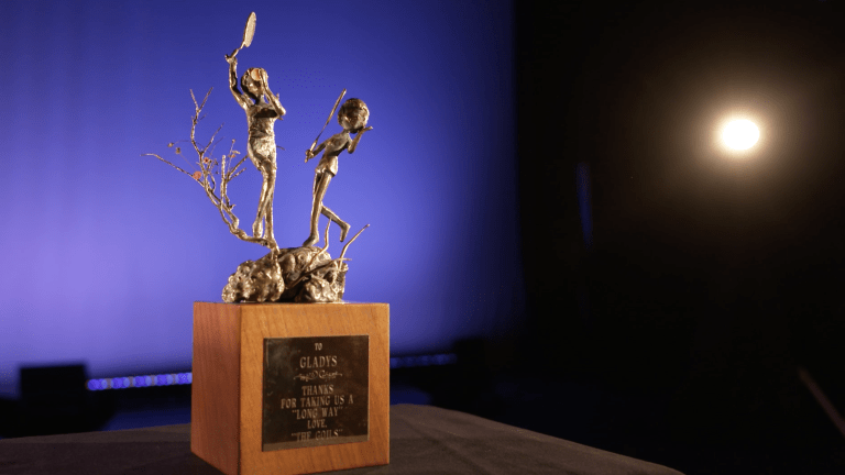 "Thanks for taking us a 'long way,'" reads the plaque on this bronze sculpture—given to Gladys Helman from "The Goils." It currently resides at the International Tennis Hall of Fame in Newport, R.I., which will commemorate the WTA Tour's 50th anniversary this year.