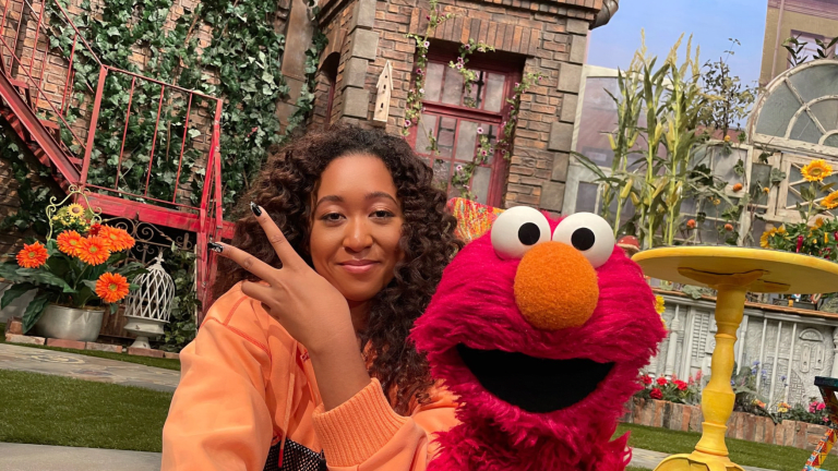 Naomi Osaka snaps a selfie with Elmo after appearing on an episode of Sesame Street.