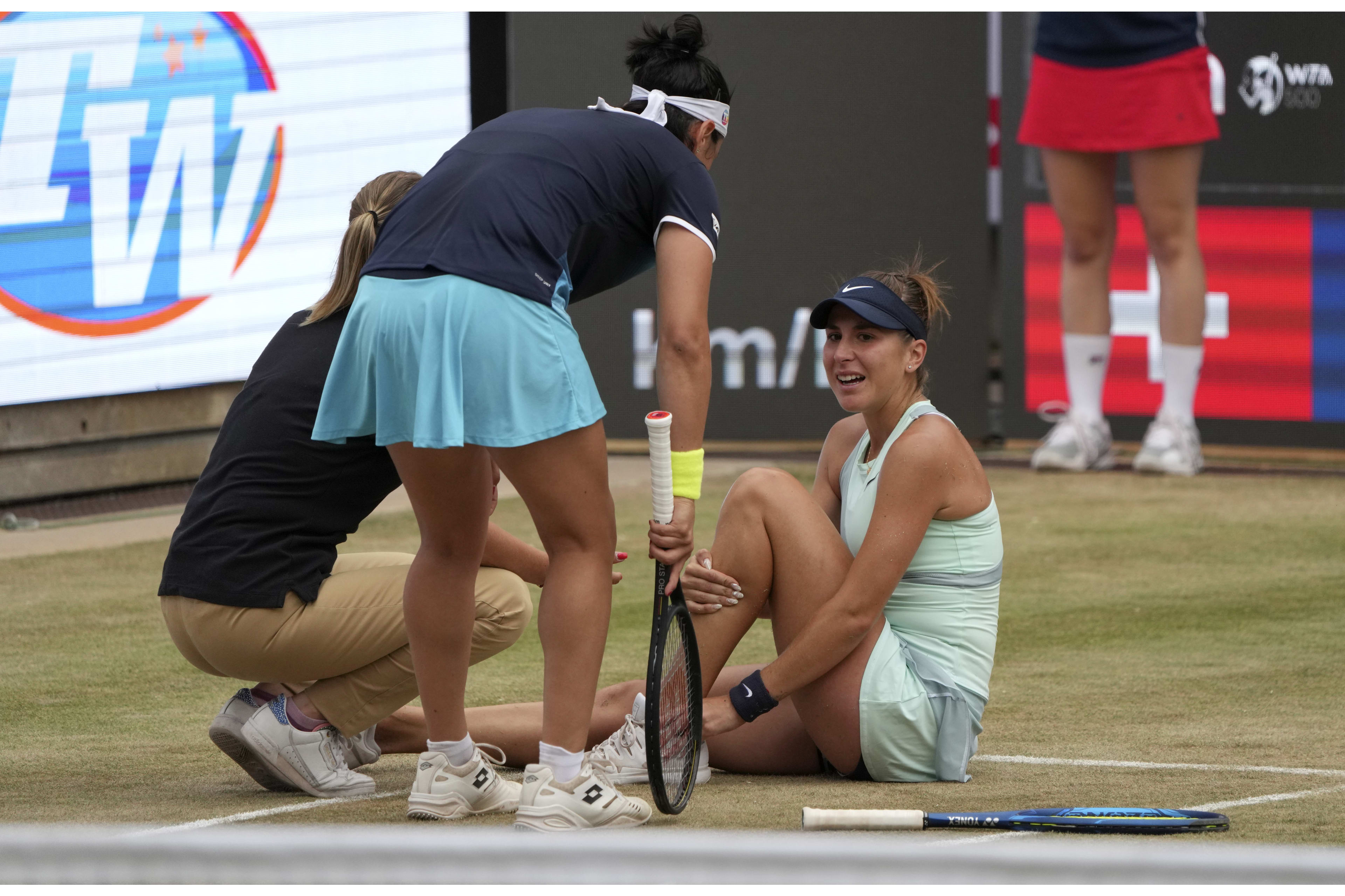 Ons Jabeur comforts injured Belinda Bencic after winning shortened Berlin final