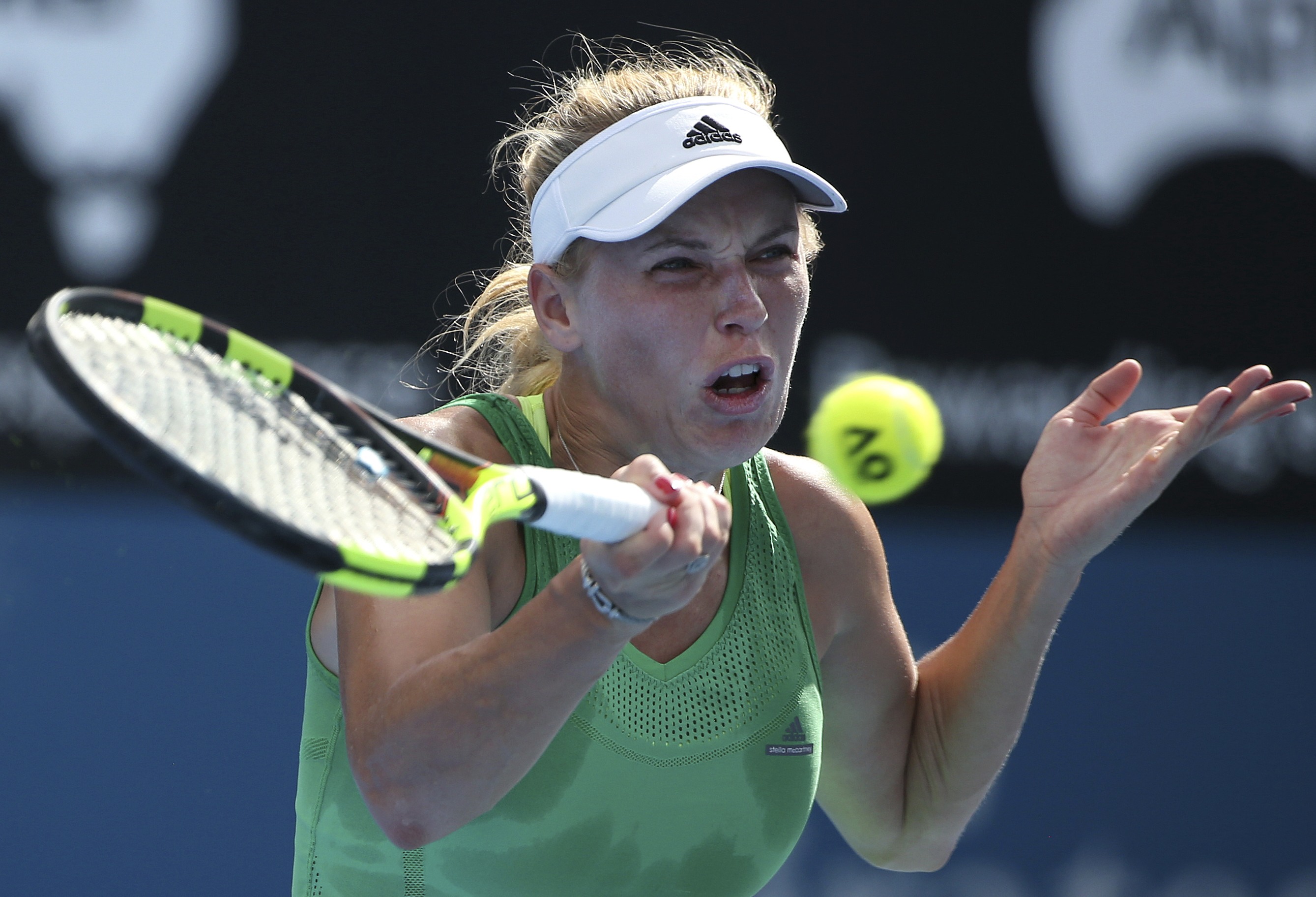 Former No. 1 Caroline Wozniacki beats Olympic champion Puig in Sydney