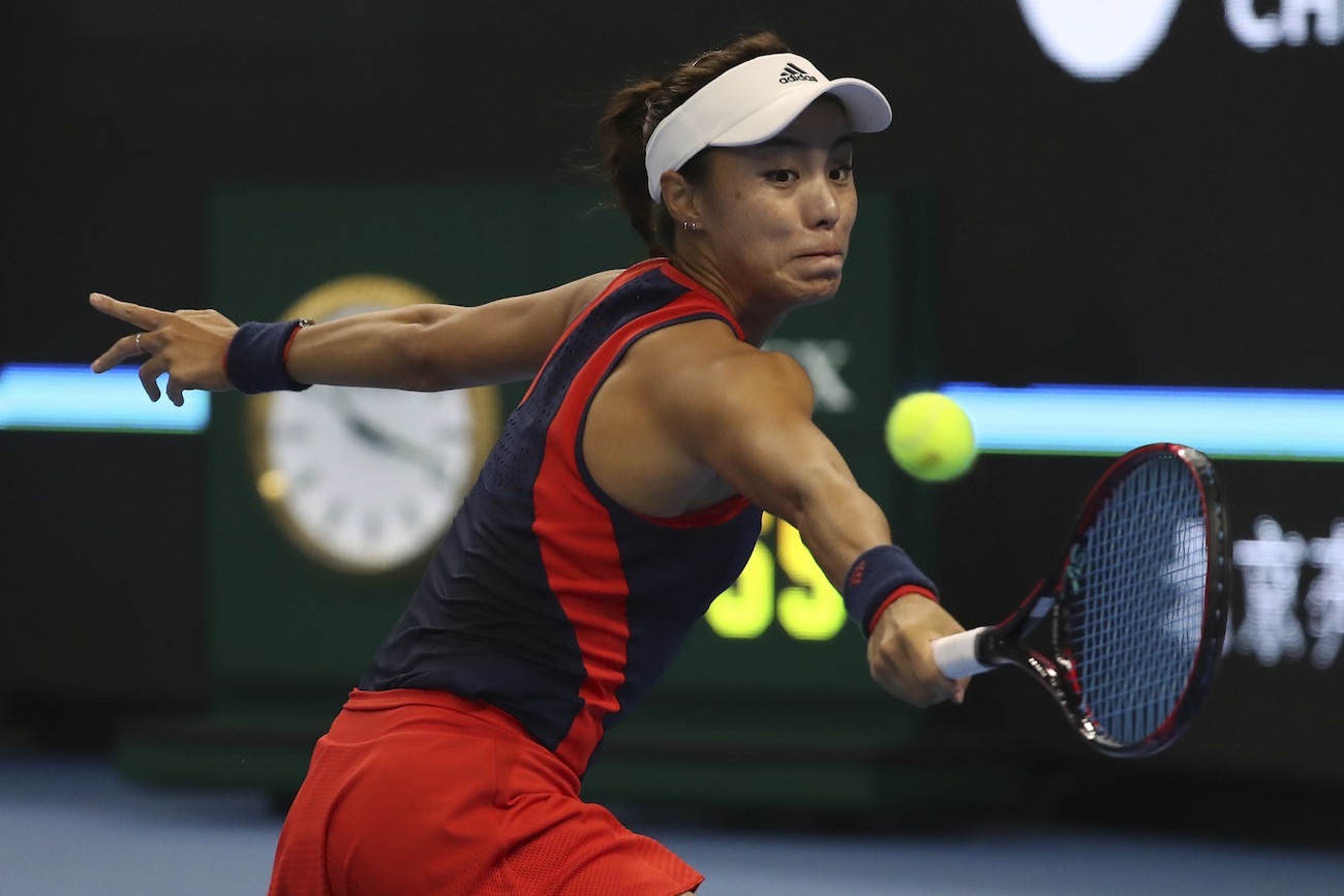 Wang keeps on marching through Beijing draw