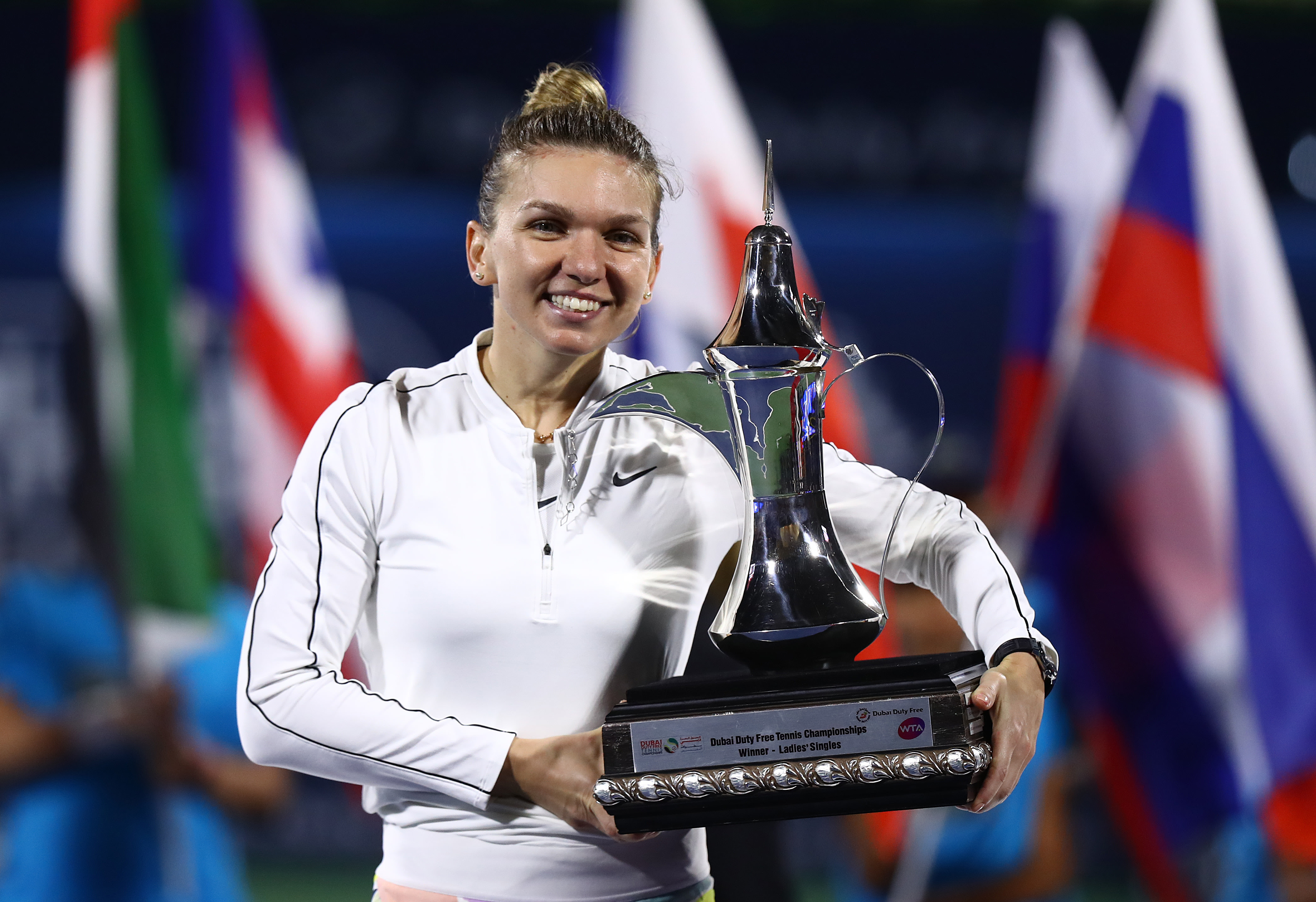 Halep picks up 20th WTA title by squeaking past Rybakina in Dubai